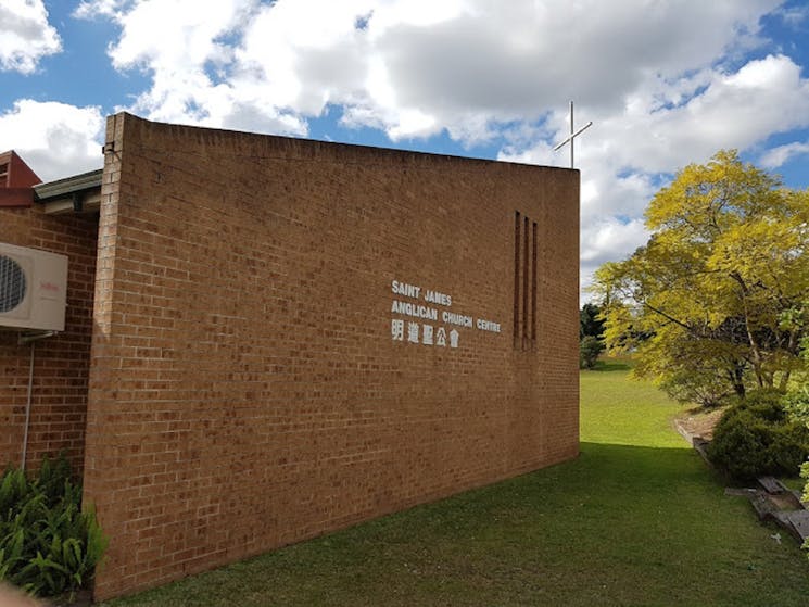 Minto Anglican church building with its name on the wall