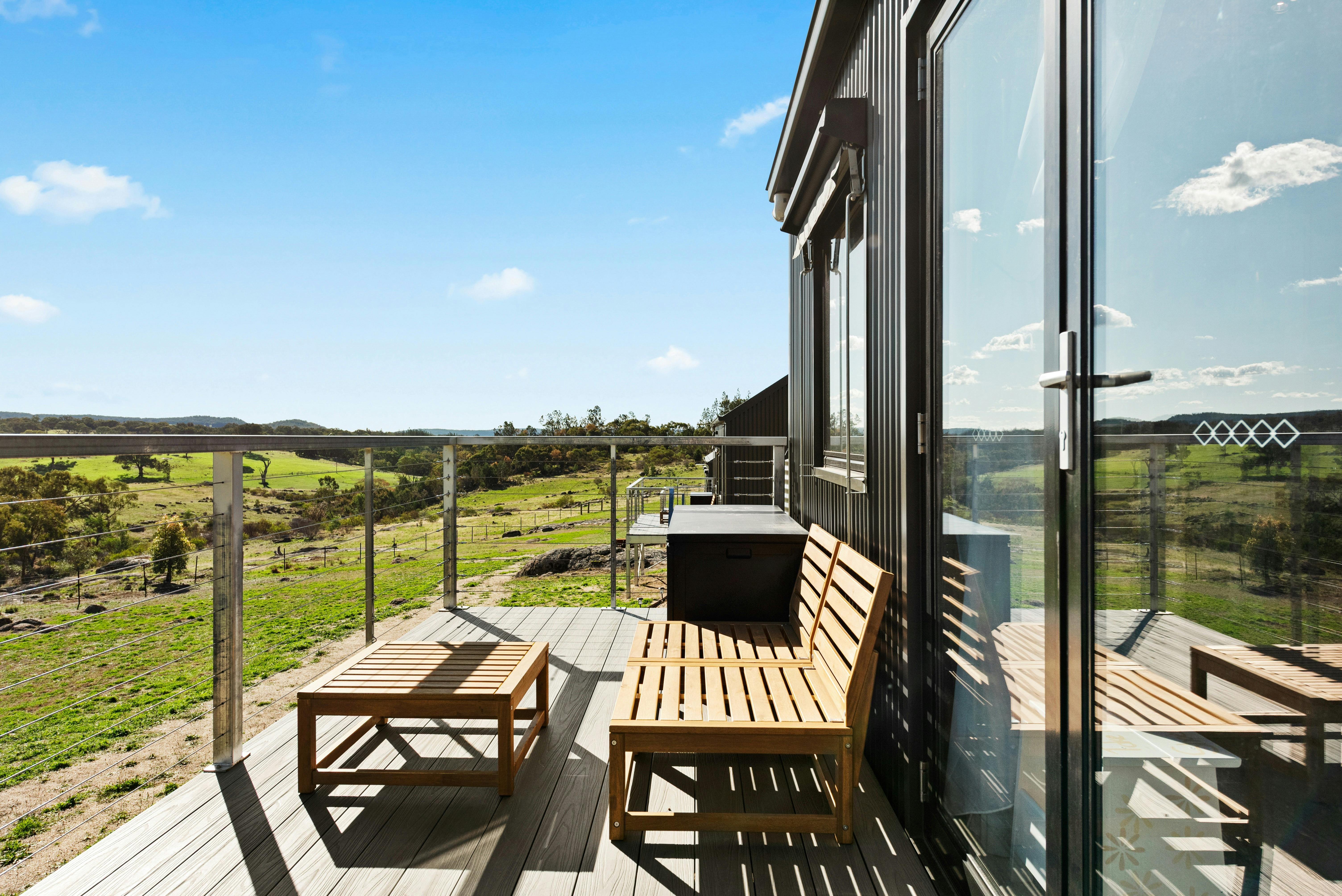 Outdoor deck with seating and blue sky