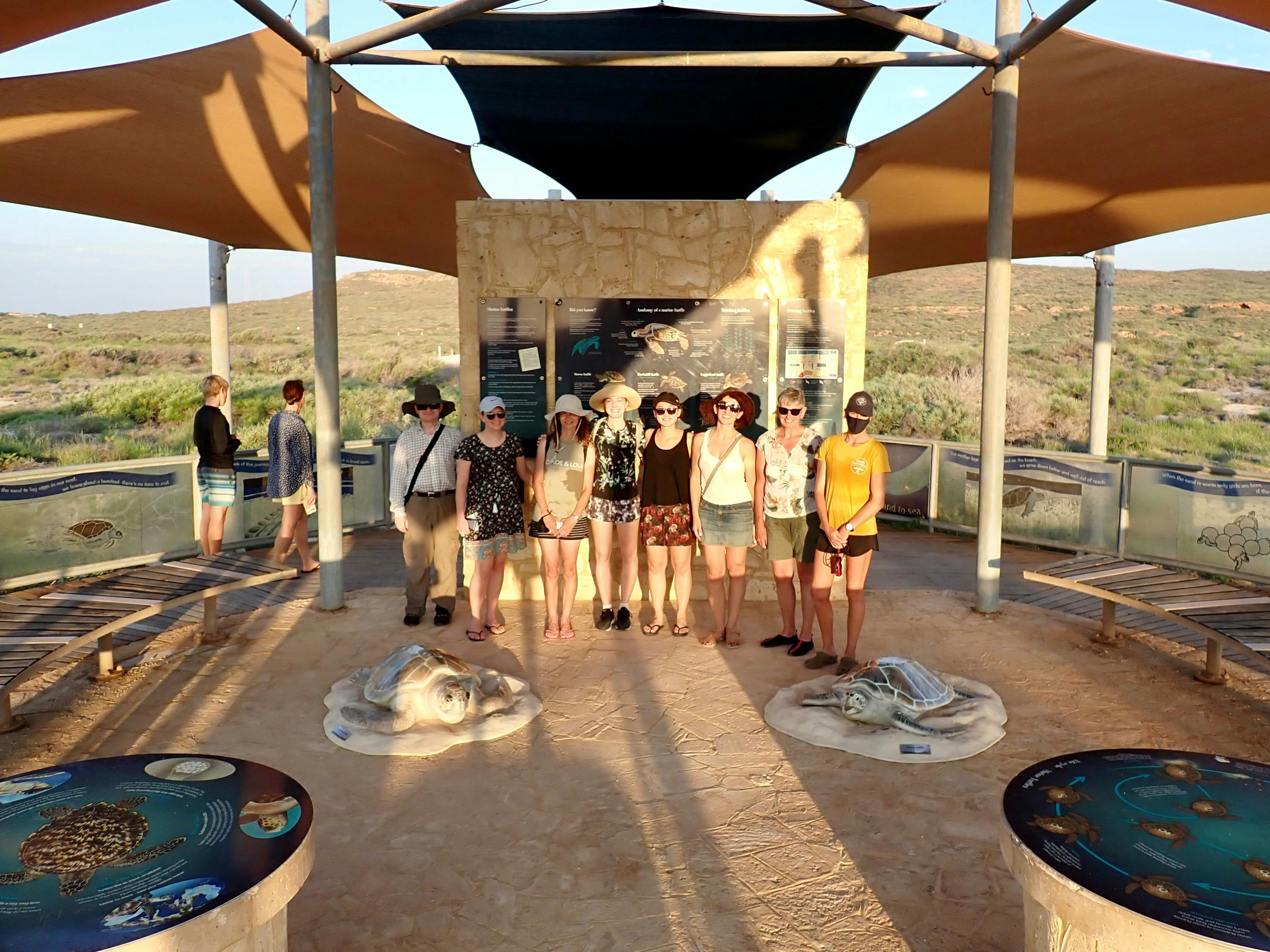 A group of people posing for the camera at the Jurabi Turtle centre