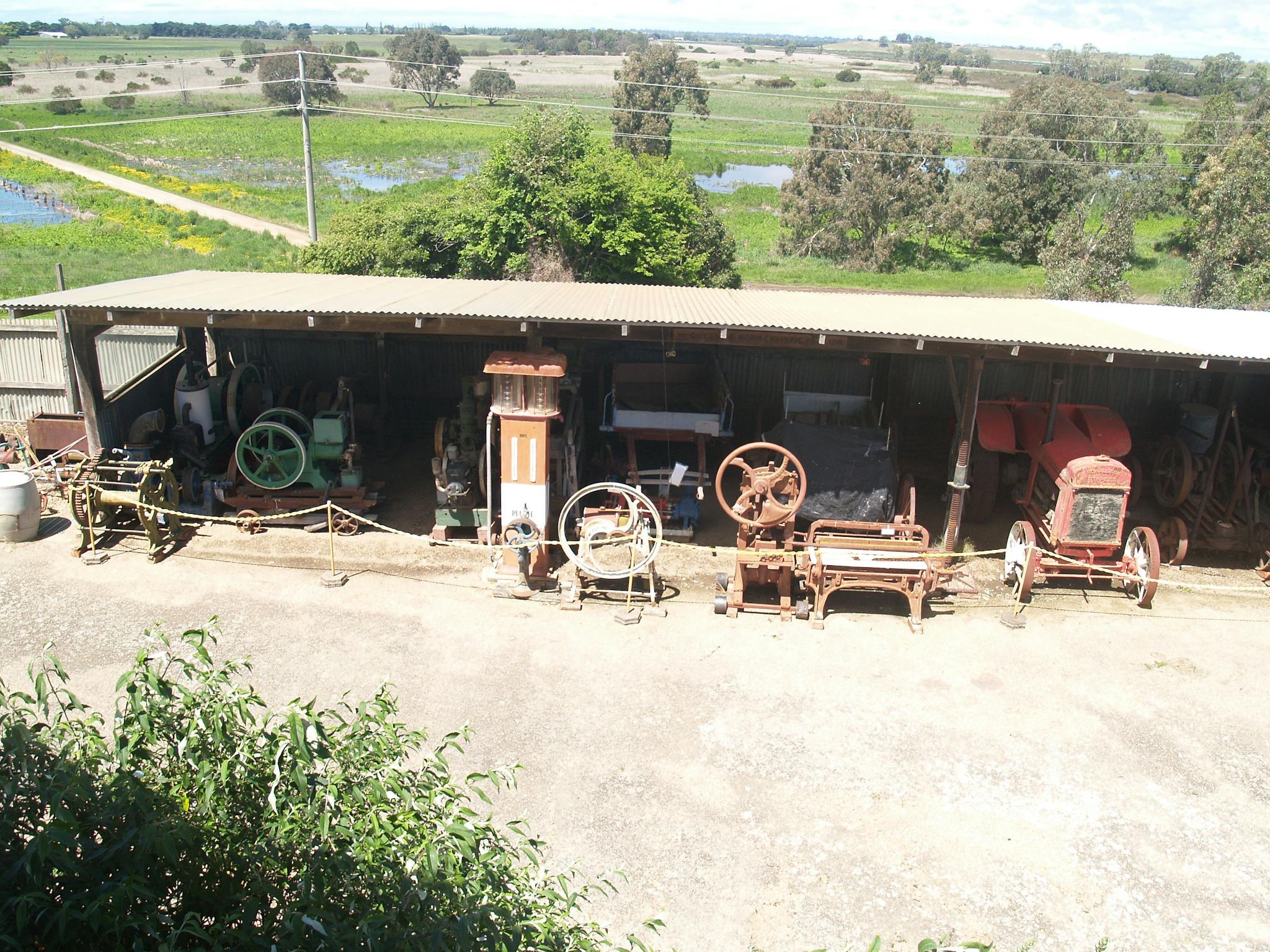 Part of the machinery collection showing stationary engines, petrol bowser, brick stamper and drays