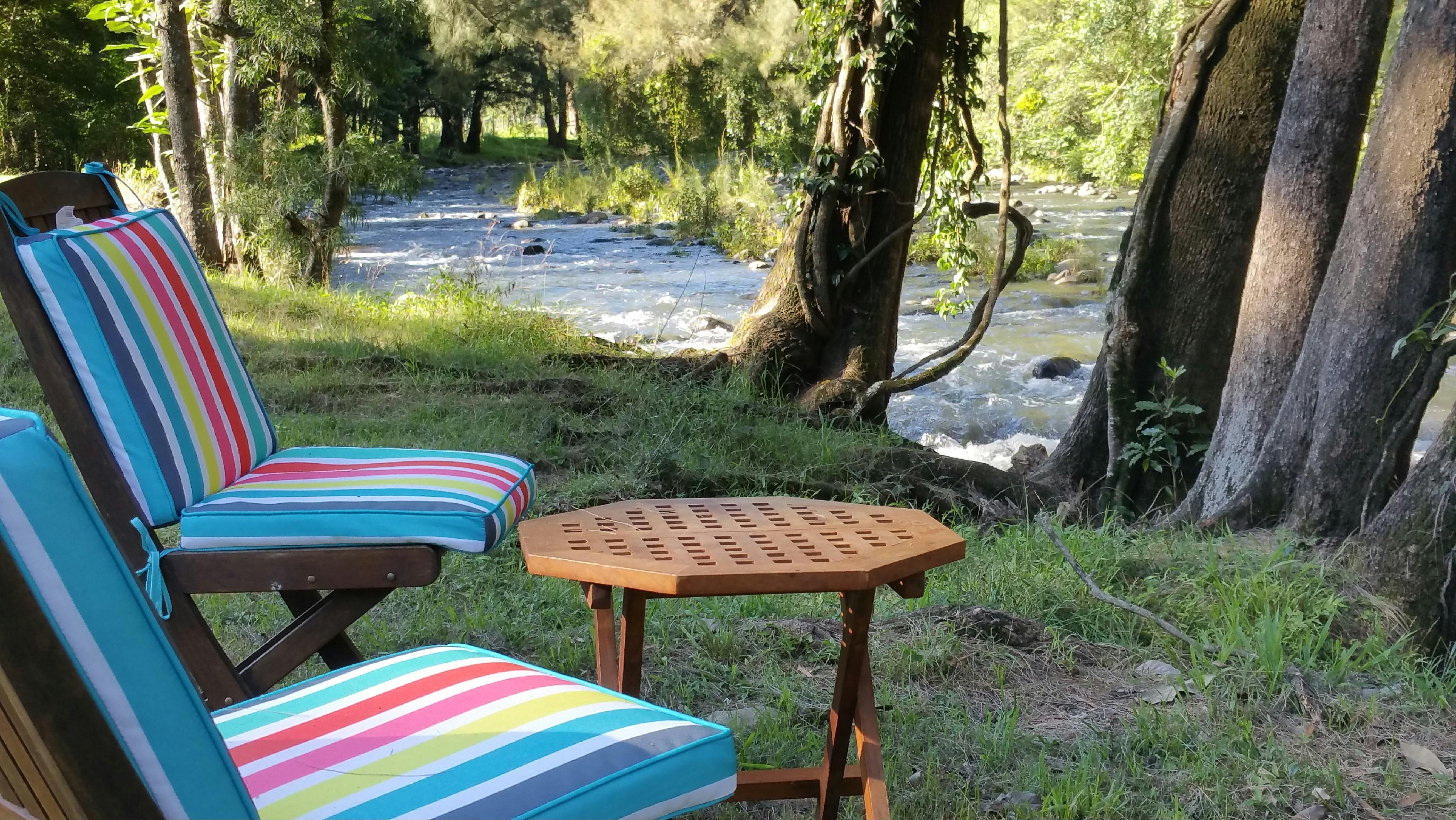 chairs beside river