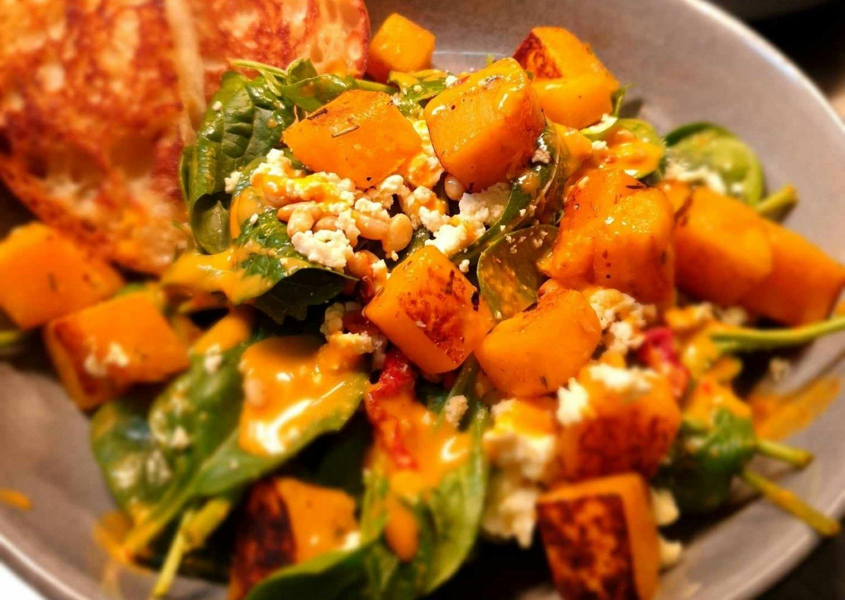 Honey roasted pumpkin salad served with pine nuts, fetta, sundried tomatoes and turkish slices