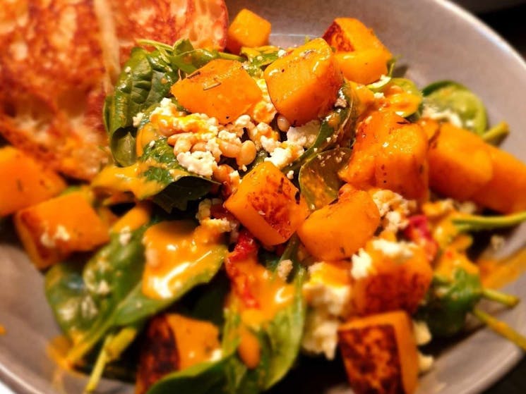 Honey roasted pumpkin salad served with pine nuts, fetta, sundried tomatoes and turkish slices