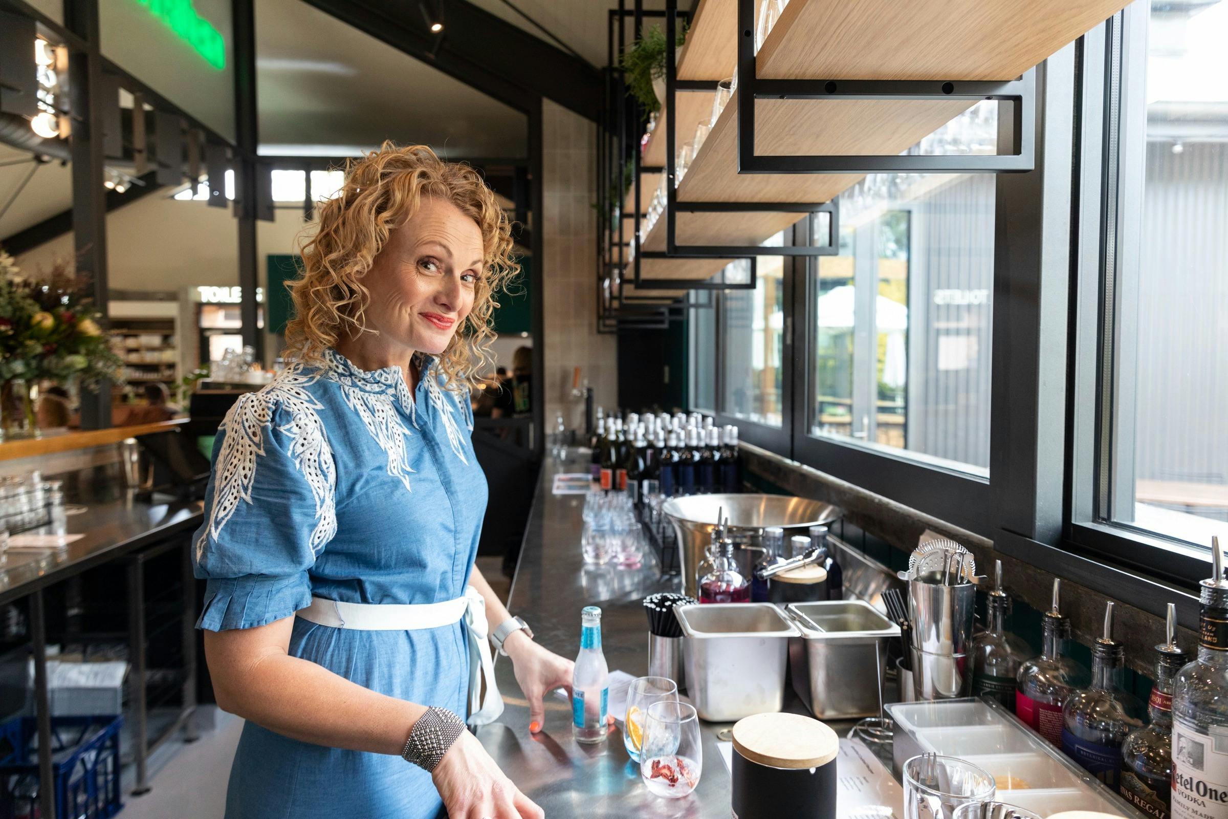 Woman smiling at bar