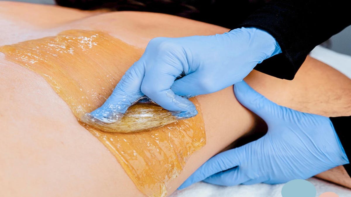 Sugaring man's back