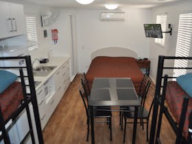 view from bunks to main bed and kitchen area
