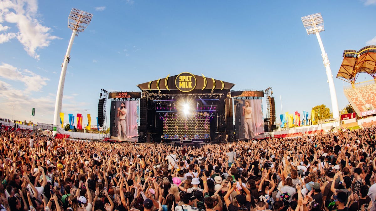 A large crowd of people watching an artist perform at Spilt Milk Festival