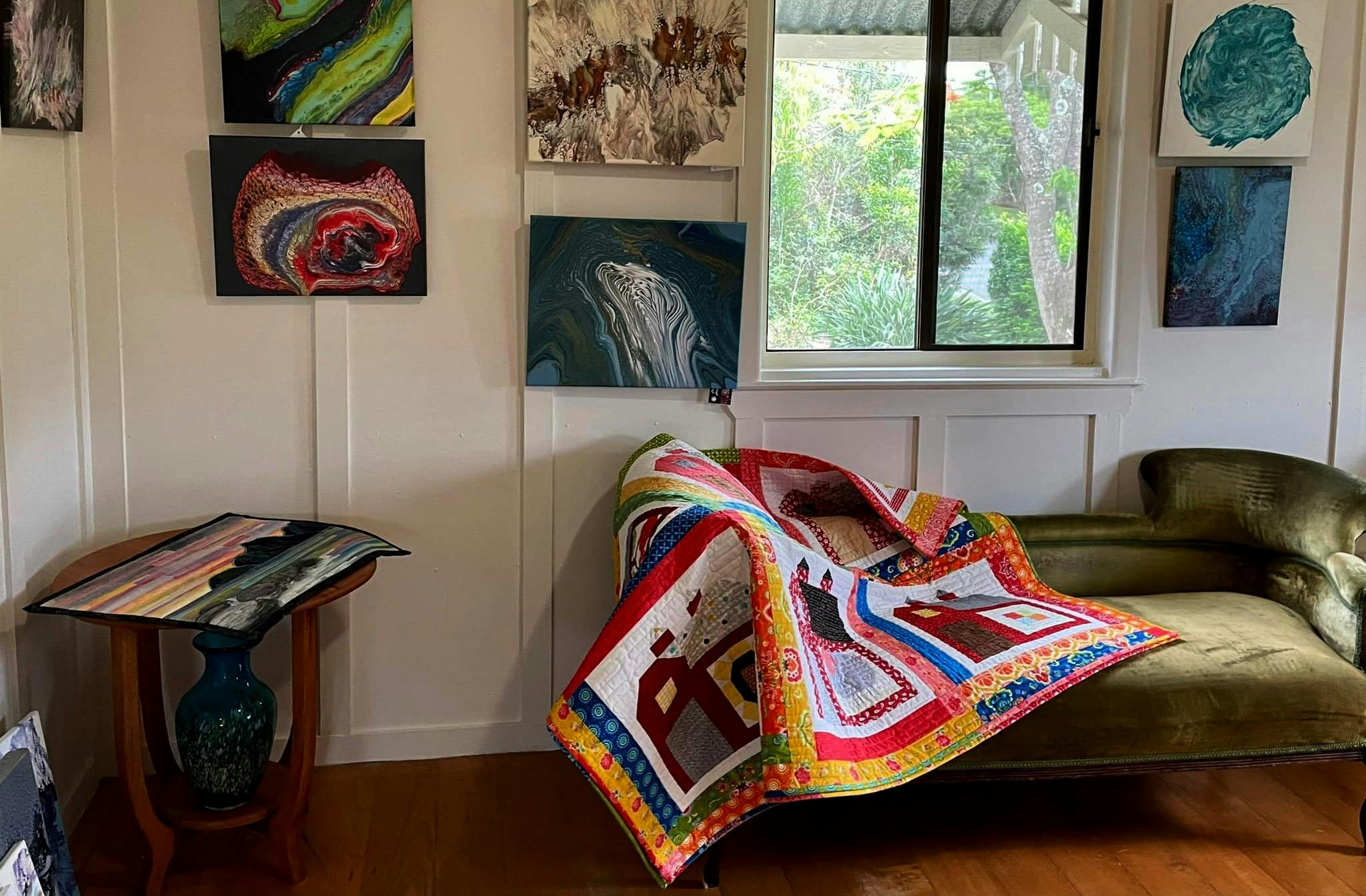 a collection of artwork and quilts