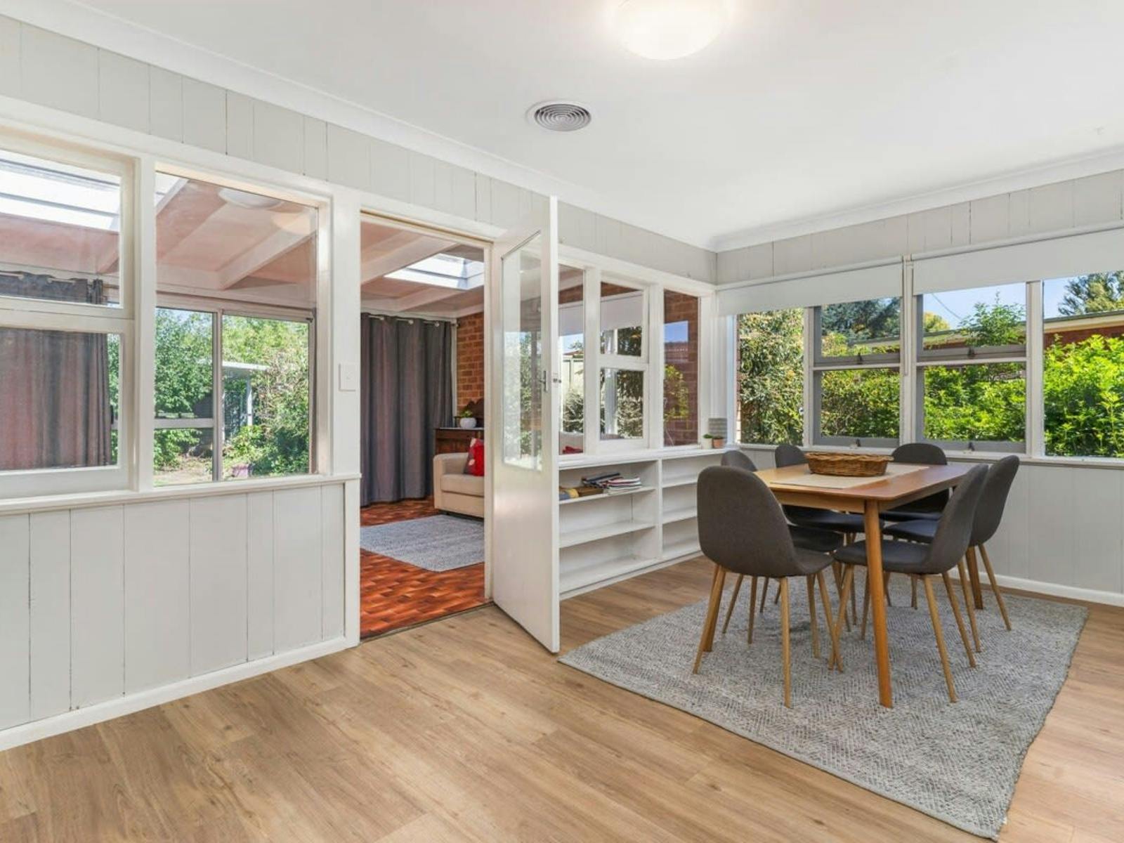 Dining room with 6 chairs and door to sunroom
