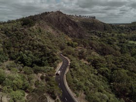 car driving into the volcanic crater