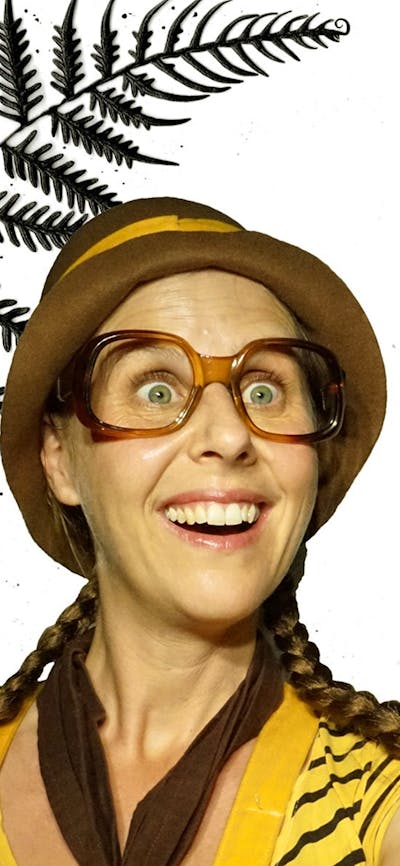 Girl with glasses holding a shadow puppet echidna hatching out of an egg