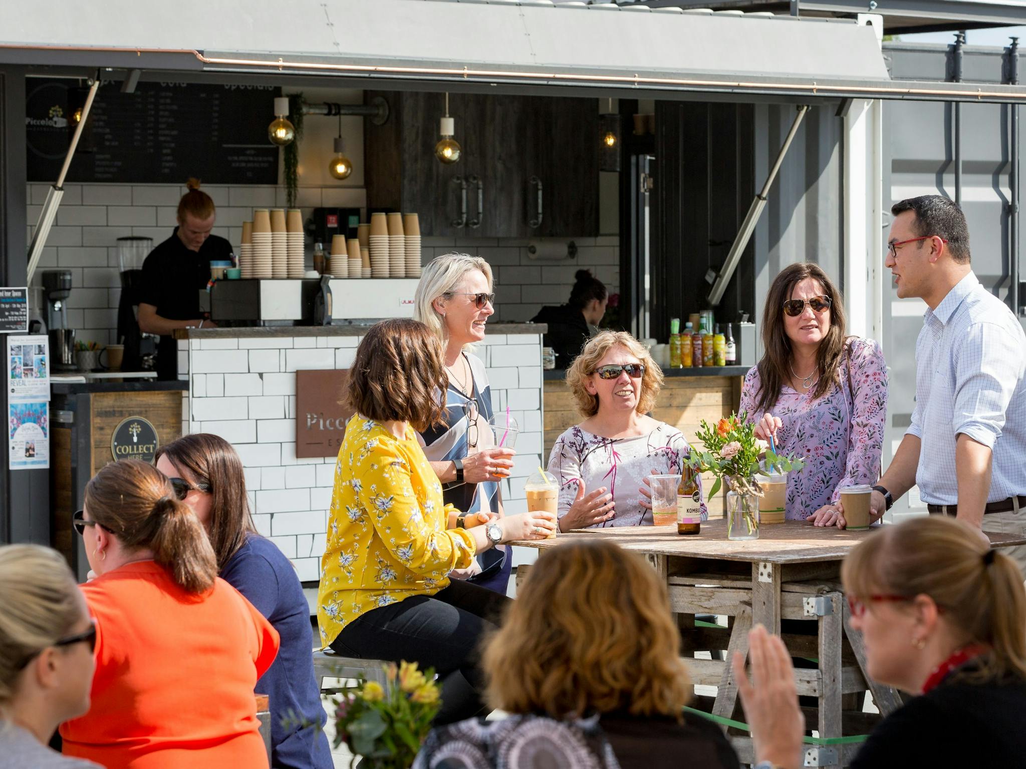 People enjoying a drink at the Piccolo Pod at Junction Place