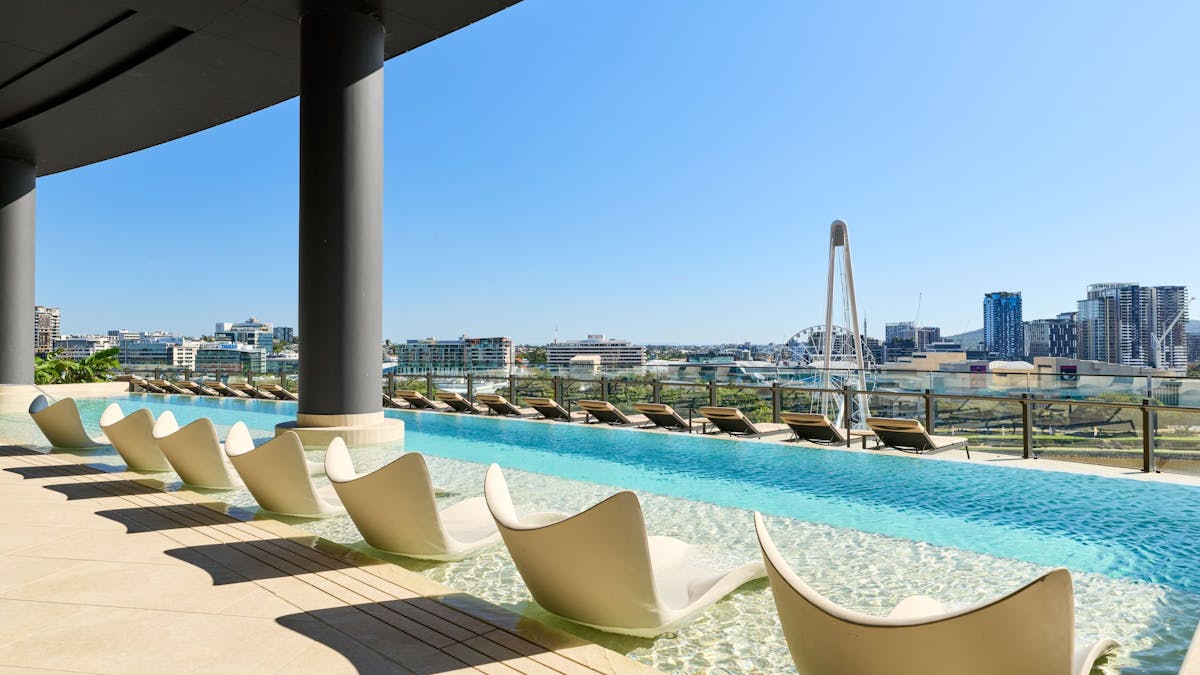 Pool beds in the pool overlooking the city