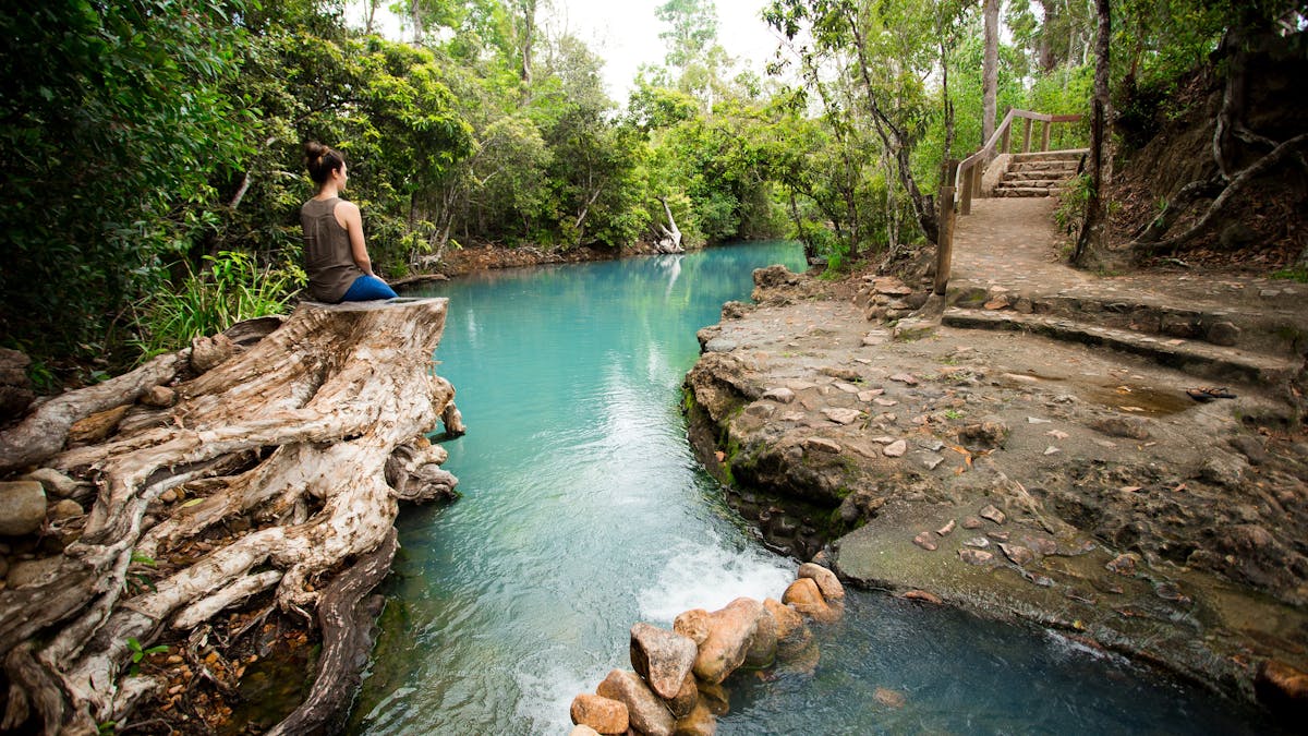Young woman admiring the view at the Cardwell Spa Pool