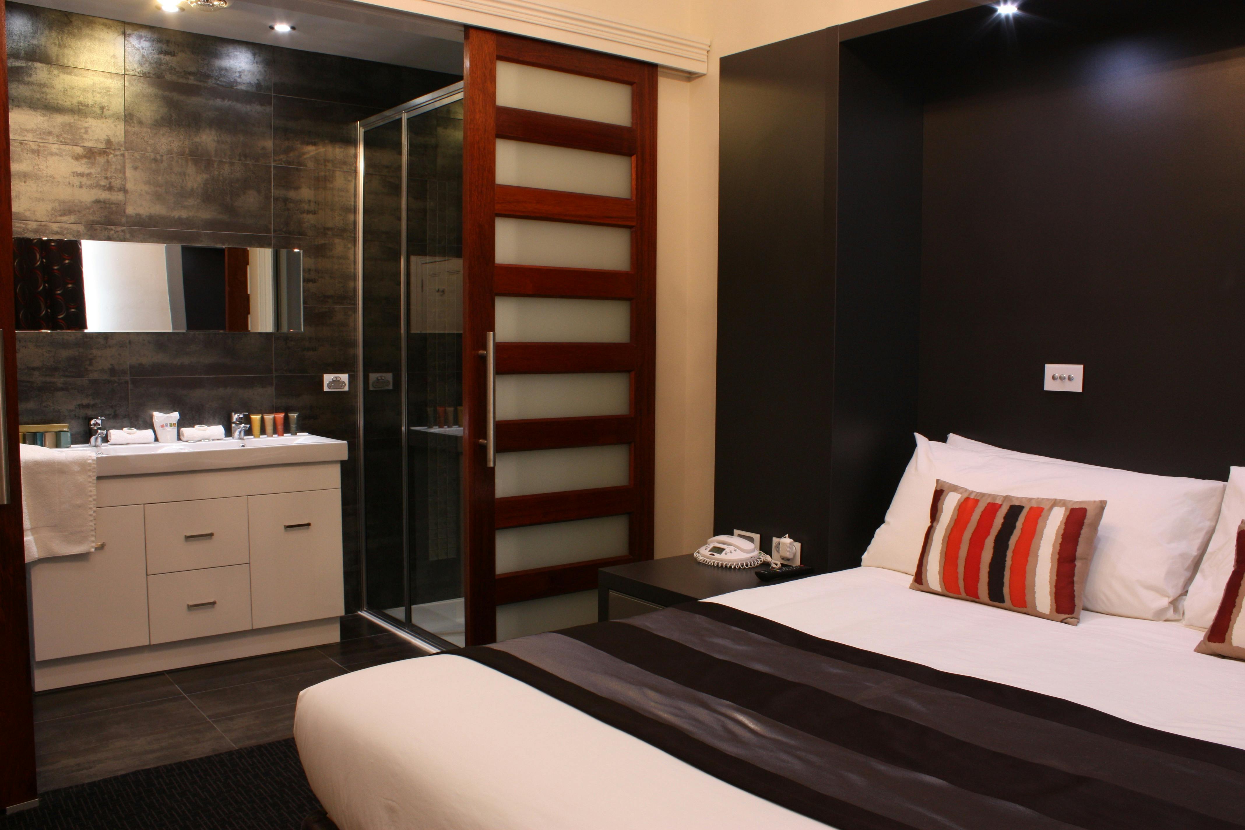 Penthouse Bedroom with king bed and ensuite bathroom