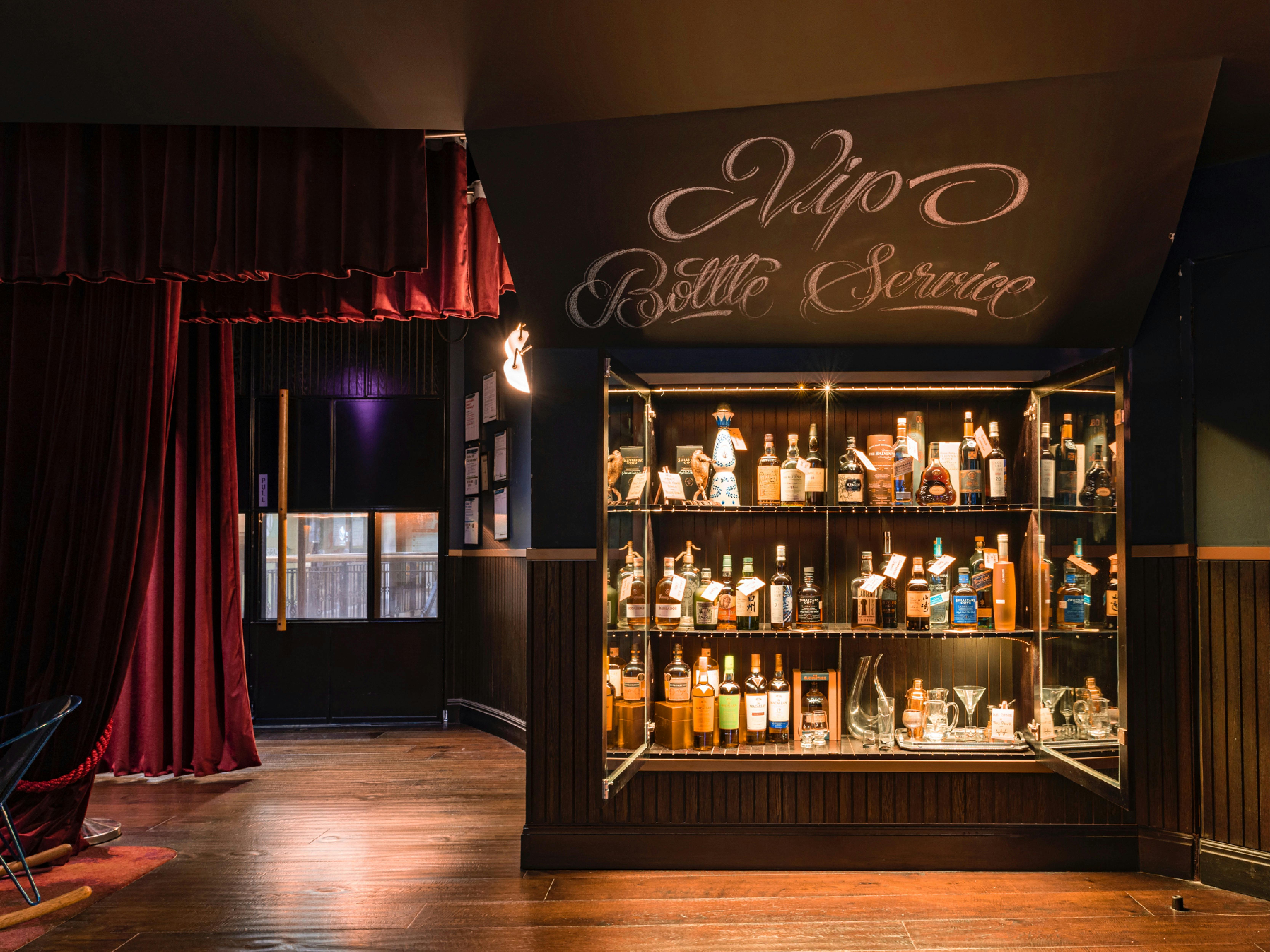 VIP cabinet with a collection of bottles in a glass cabinet