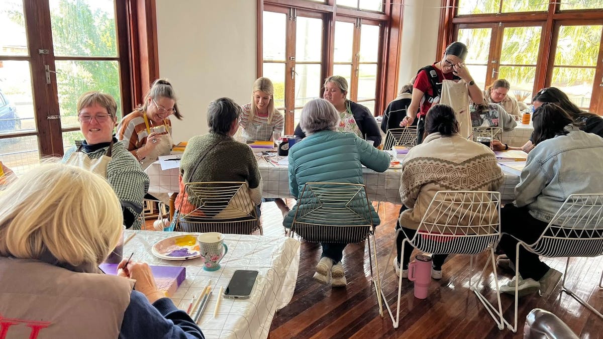 A group of adults enjoying paint and sip classes at the Retreat Cunnamulla in The Old RSL A group of adults enjoying paint and sip classes at the Retreat Cunnamulla in The Old RSL