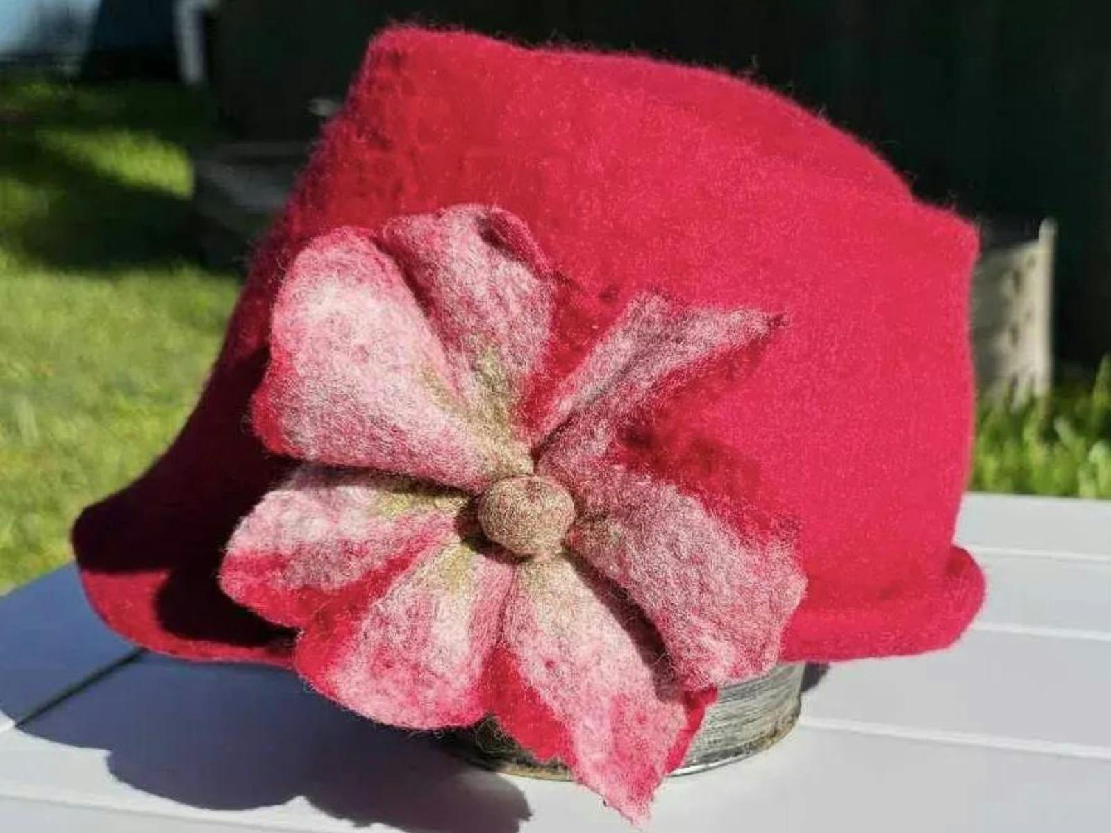 Red felt hat with pink felt flower