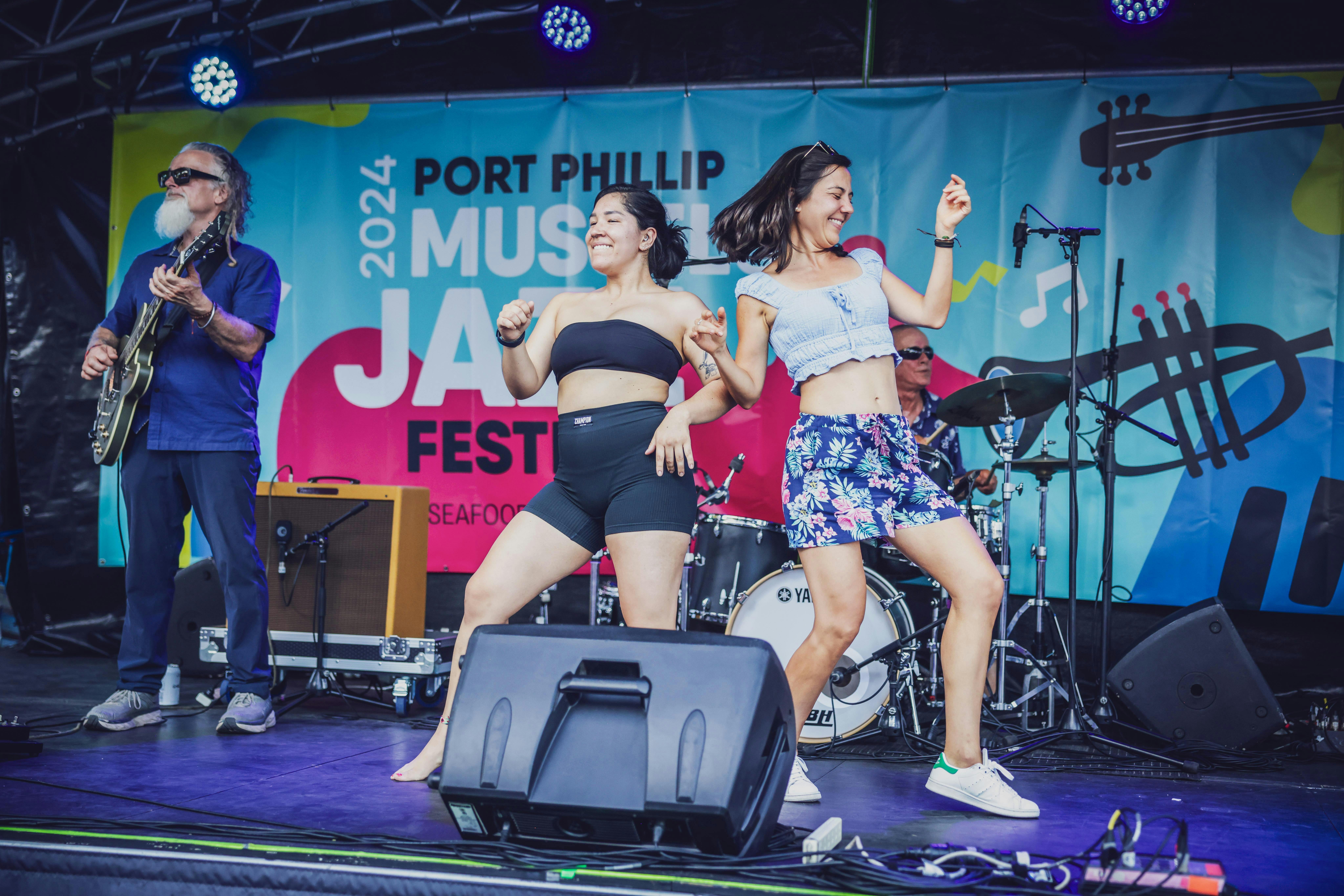 Two performers dancing on stage at the Port Phillip Mussel & Jazz Festival