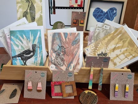 selection of handprinted linocut cards and earrings