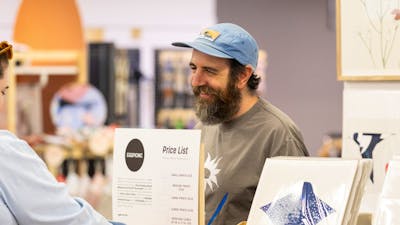 Eggpicnic talking to a customer