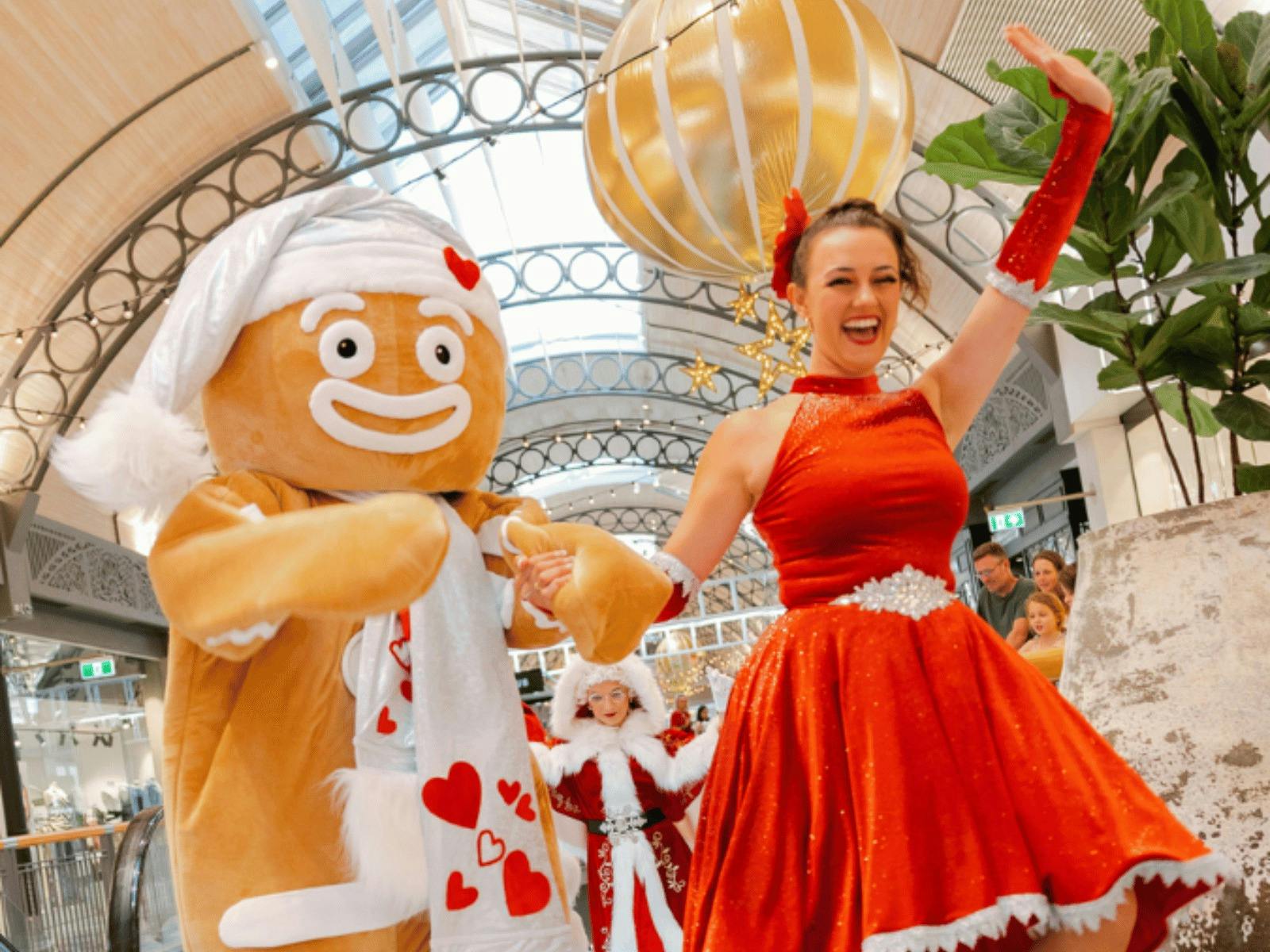 Christmas Gingerbread costume and Christmas entertainer posing at Sunshine Plaza