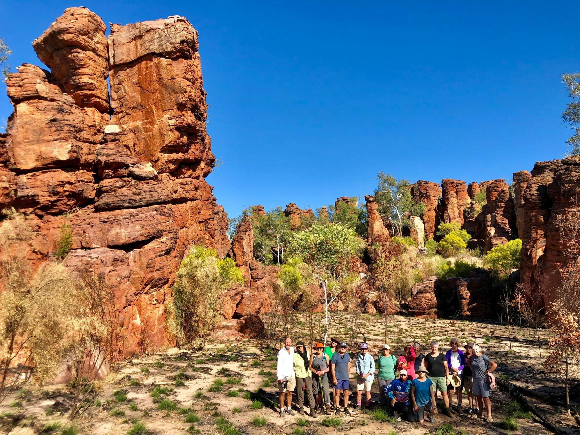 group of people at rock formation in NT