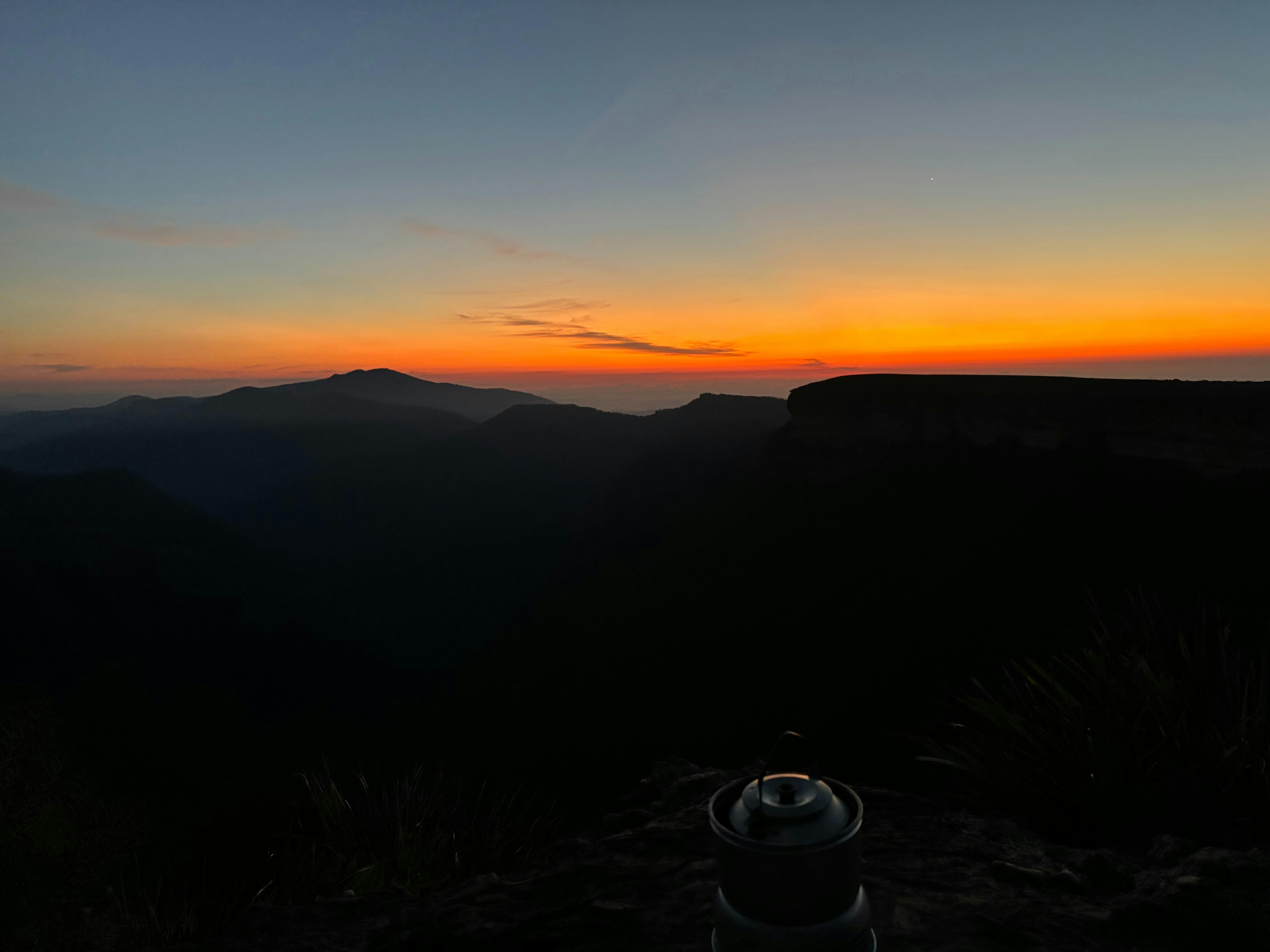 A stunning golden red sunset over a mountain range in Kosciuszko National Park