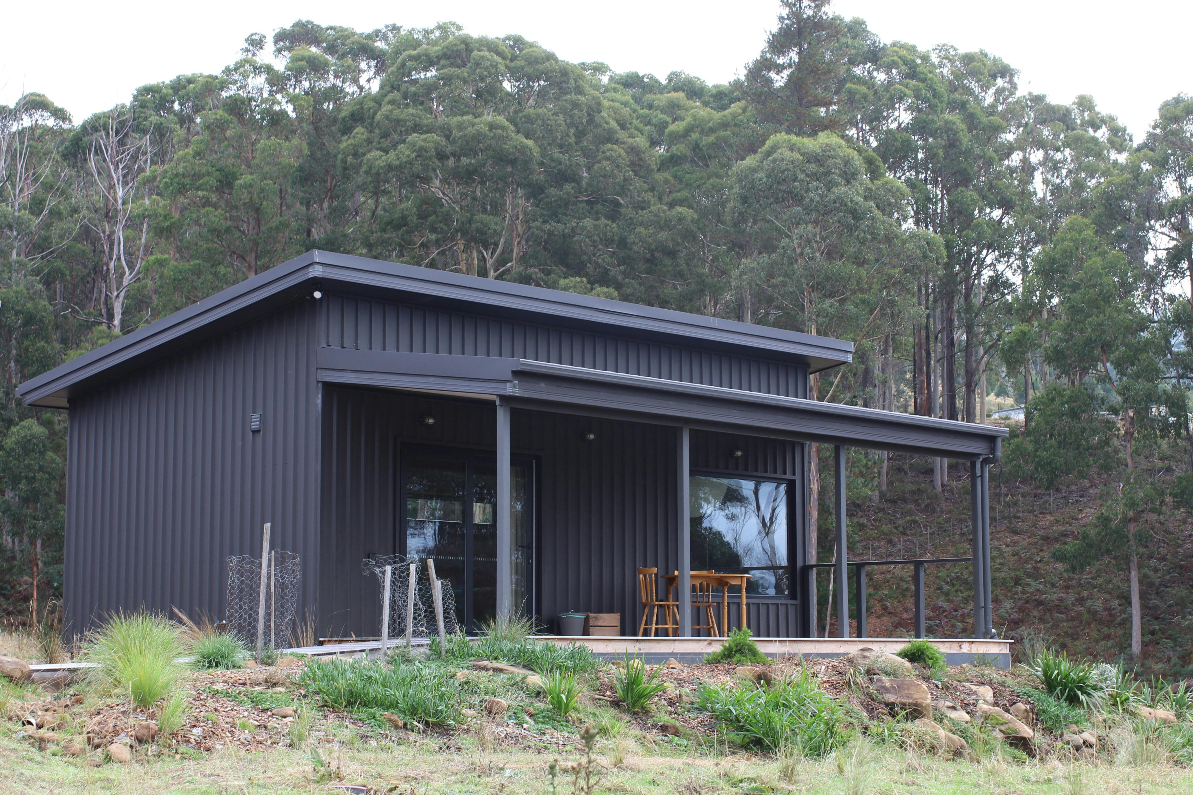 Cabin exterior and deck with table and chairs