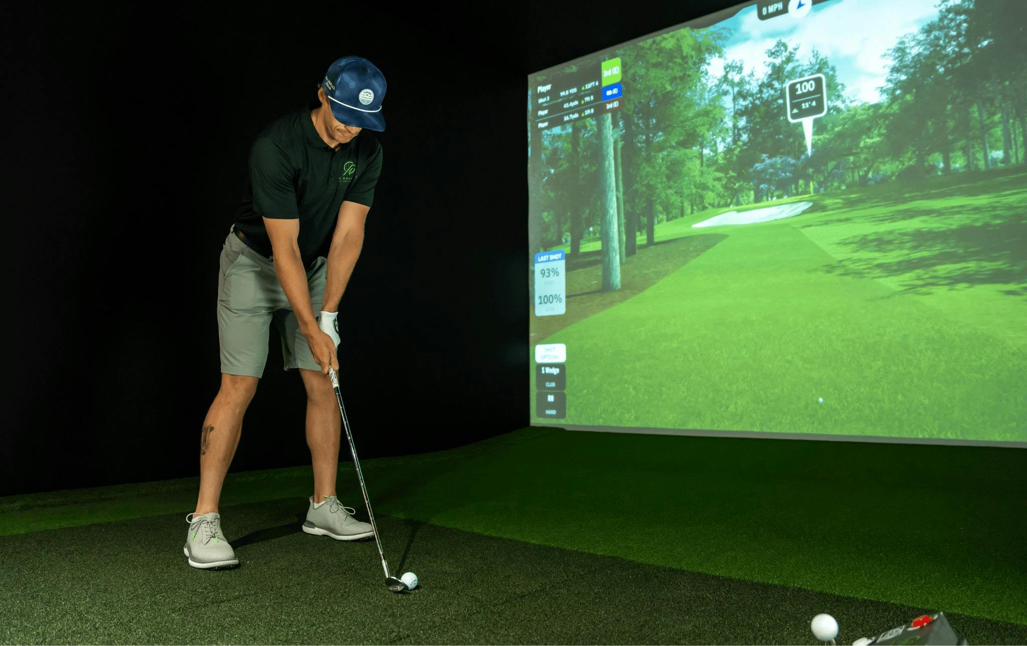 A golfer enjoys a round in the sim