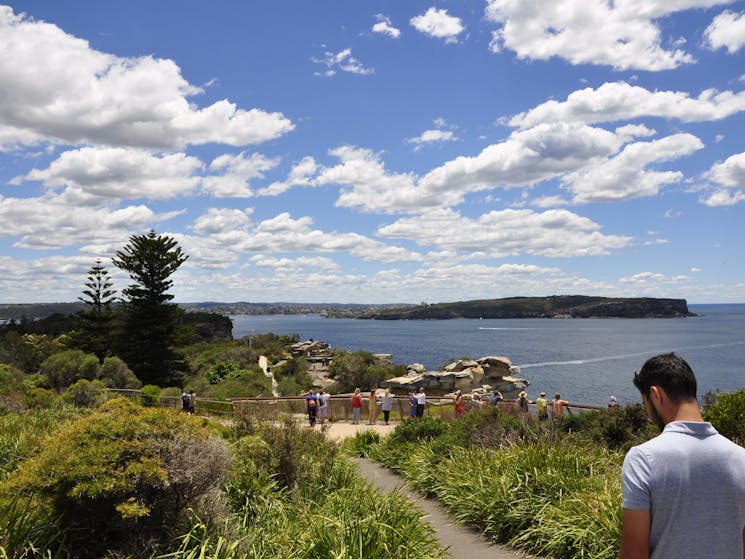 Travellers on Sydney sightseeing bus tour are enjoying vast views at South Head Sydney