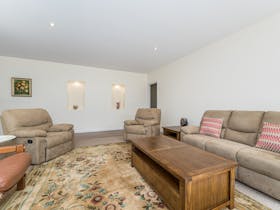 Image of second living area with comfortable furnishings timber coffee table