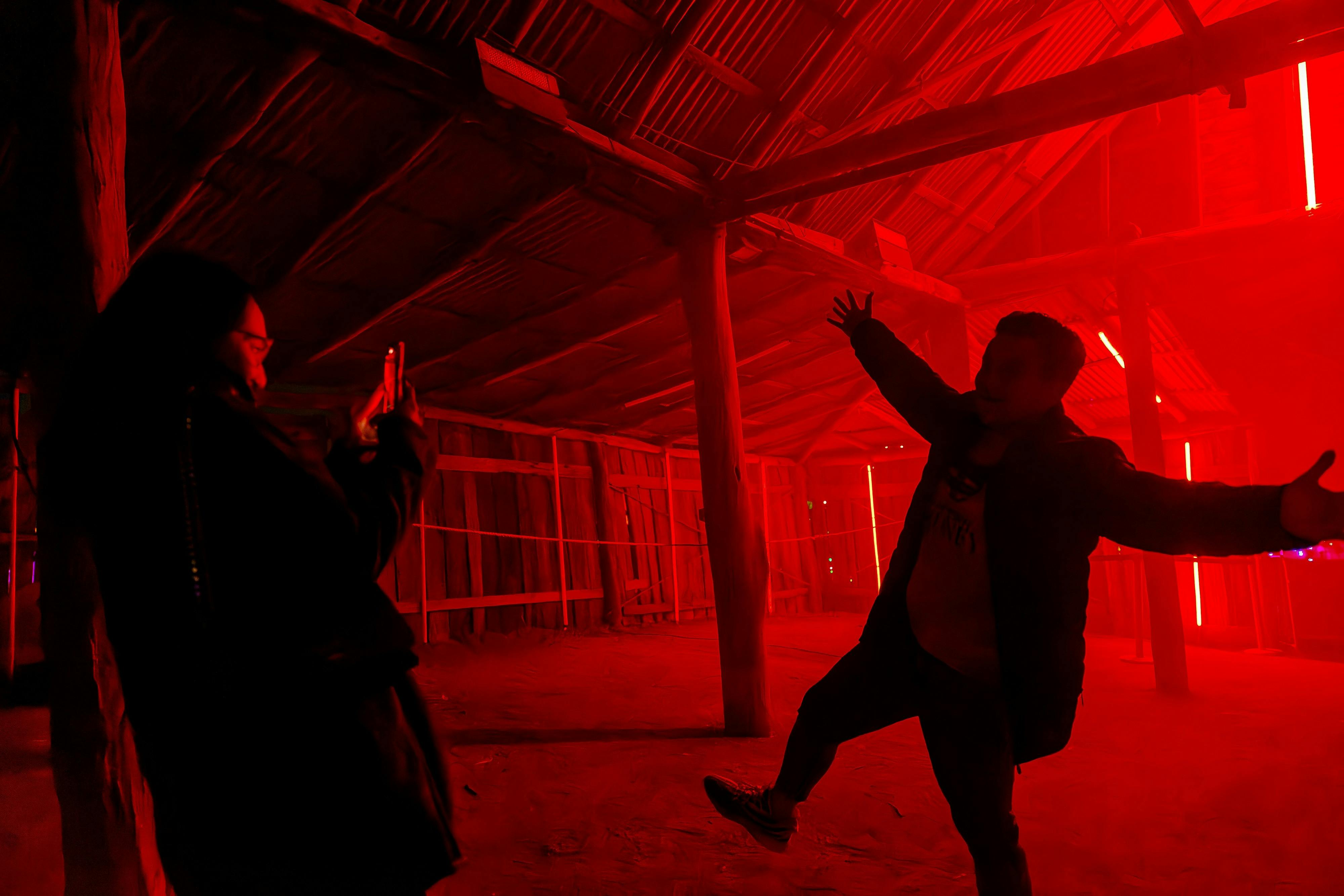 A man poses to create a silhouette effect