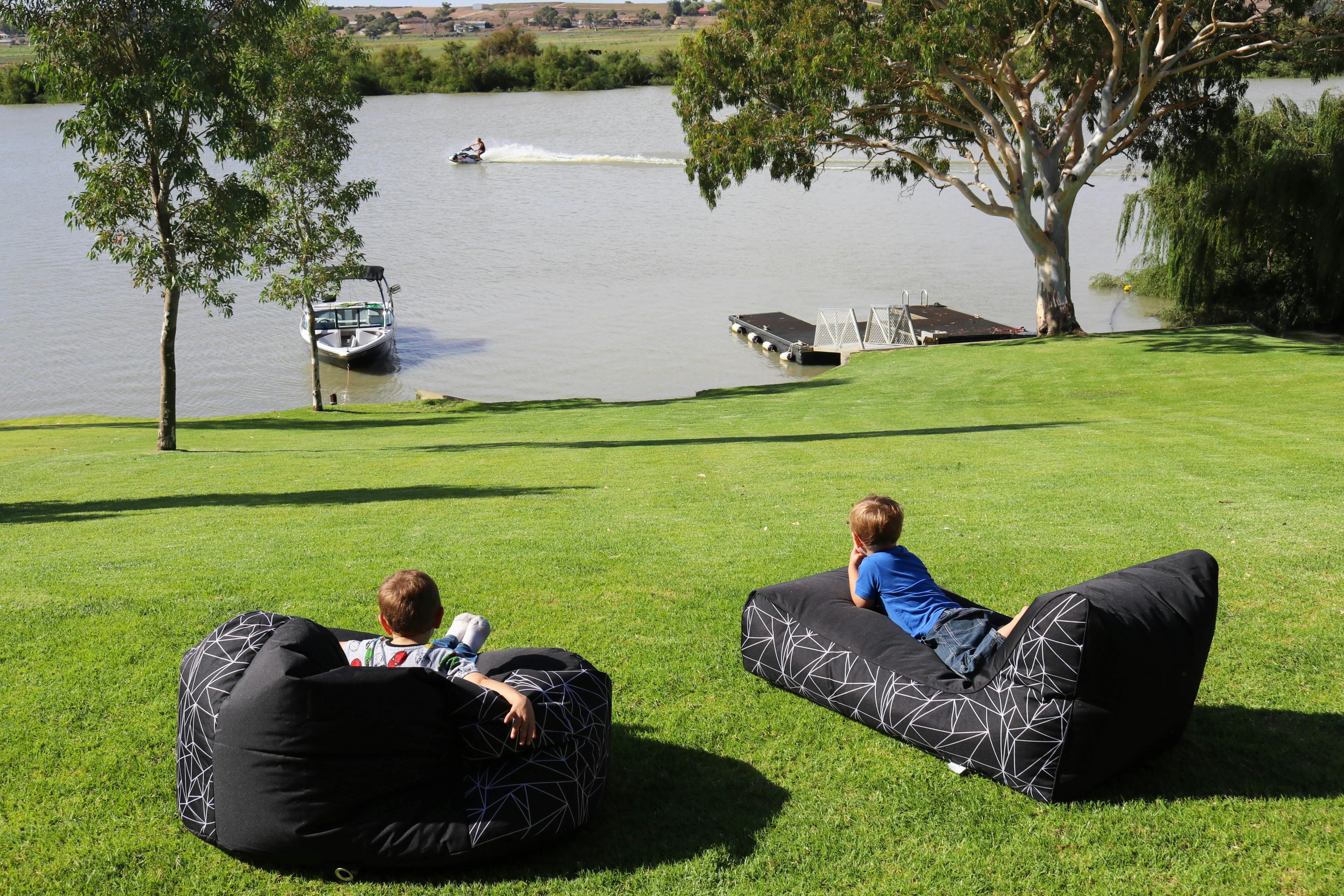 River frontage with manicured lawns are to rest and play