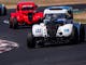 Two legend cars racing around Winton Motor Raceway