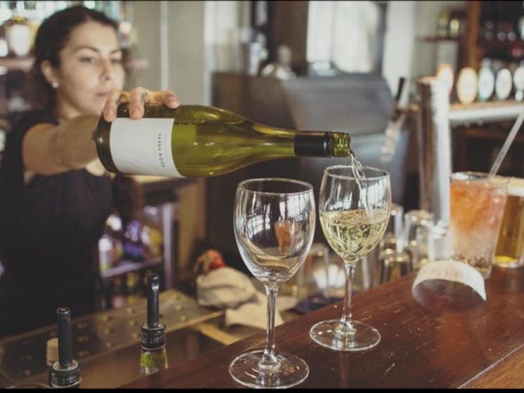 pouring wine at the bar