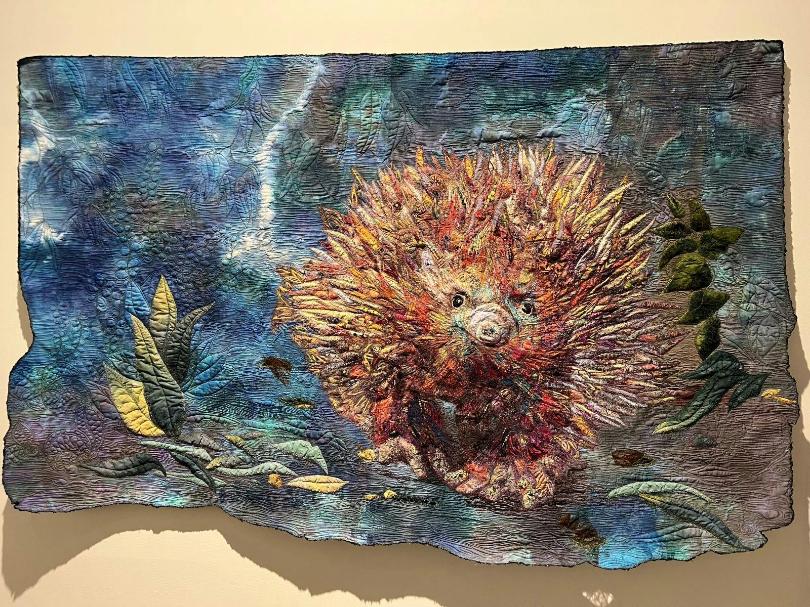photo of winning quilt from 2025 - Sue de Vanny, Unguarded Moment, 2024. A collage of fabrics.