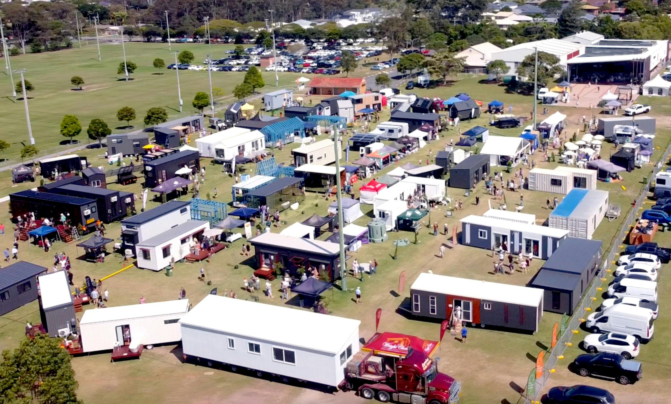drone shot of event with several tiny homes