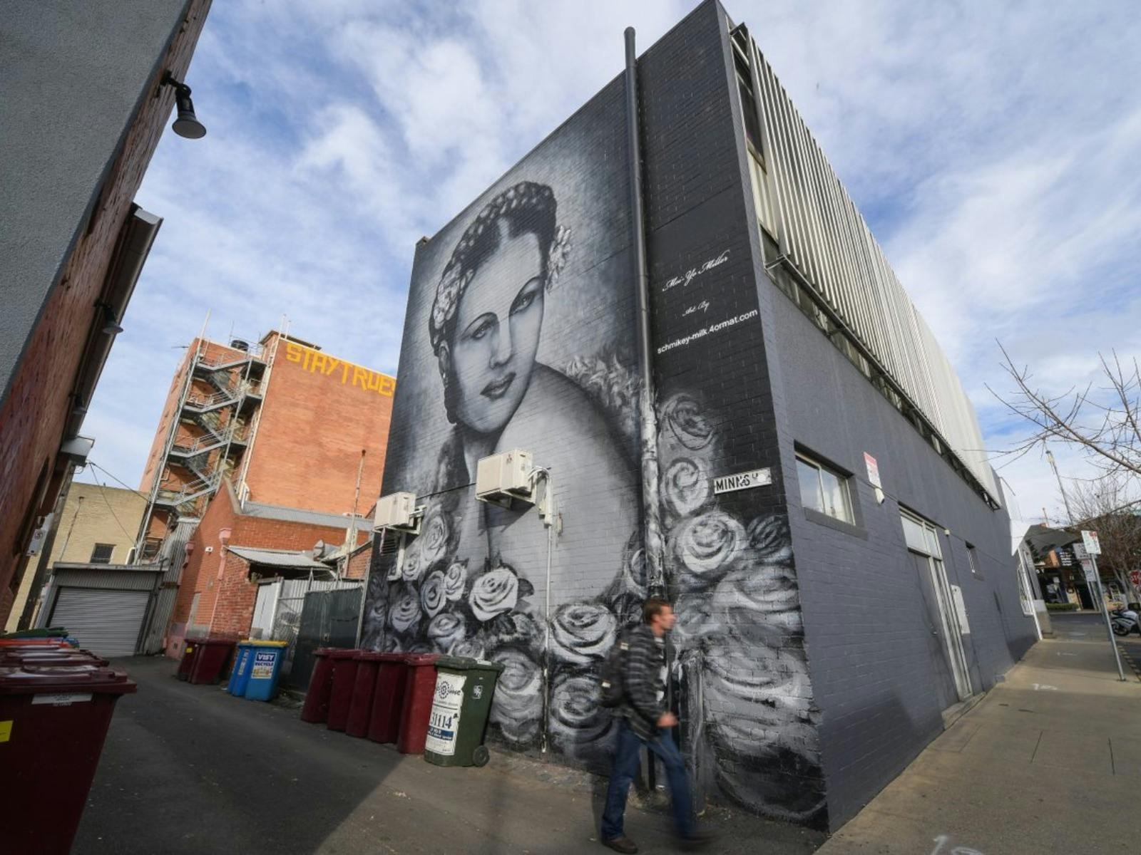 Large black and white wall painting of women