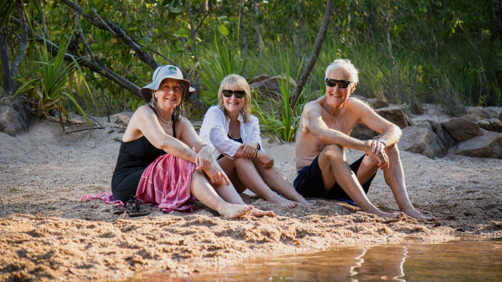 Trekkers relaxing by a waterhole on the Kakadu Walking Adventure