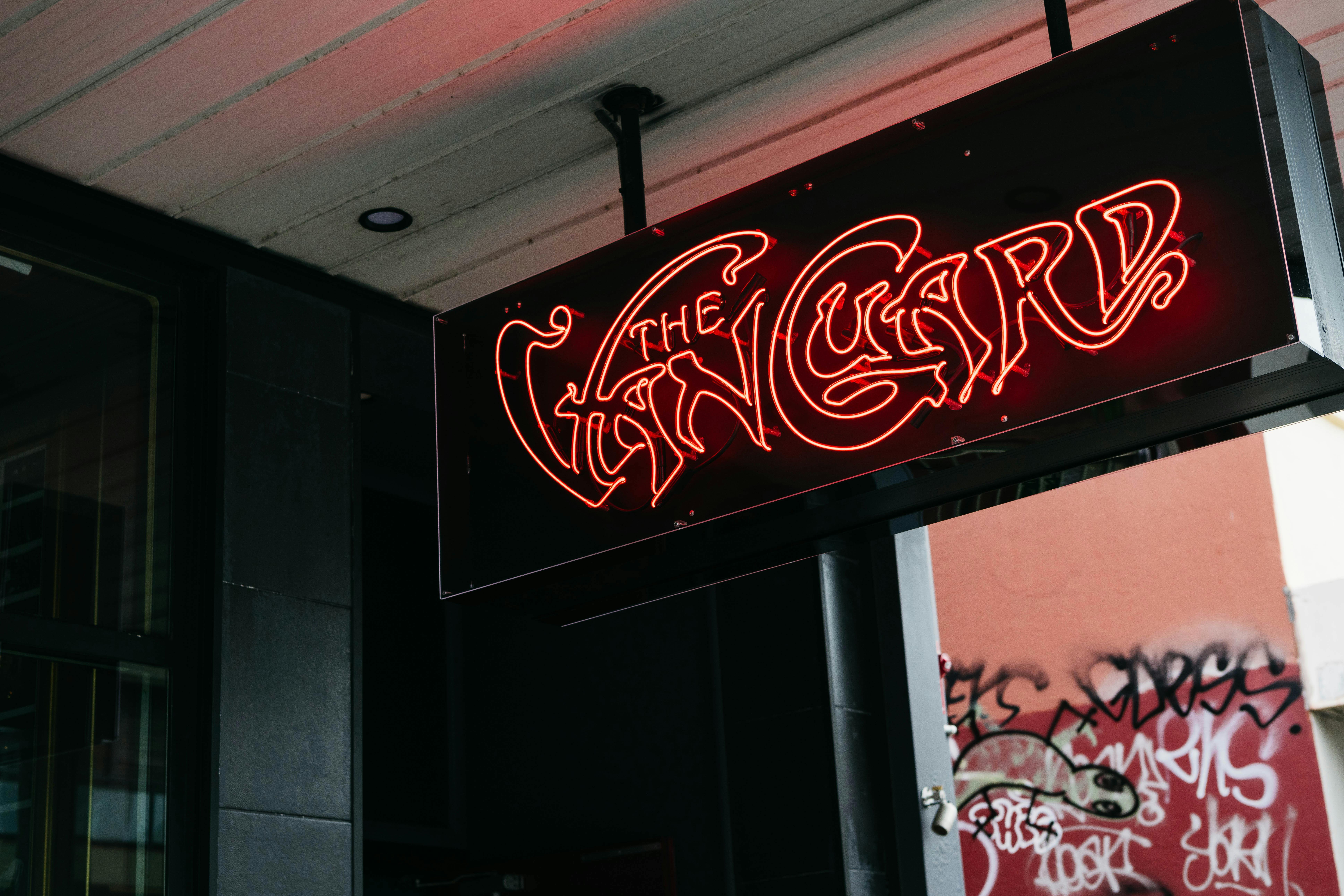 Red neon sign outside the venue