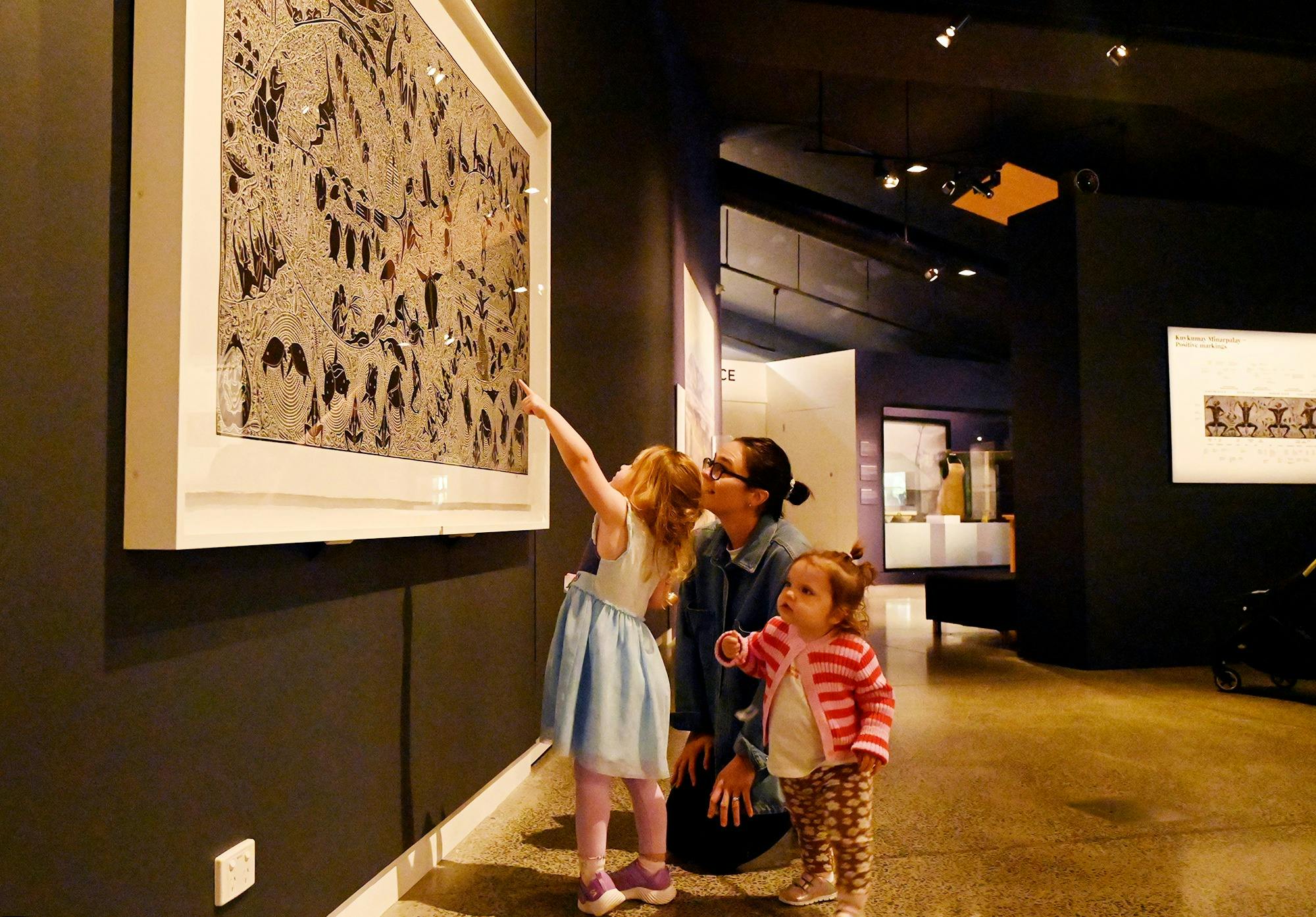 A family explores an exhibition at Orange Regional Museum