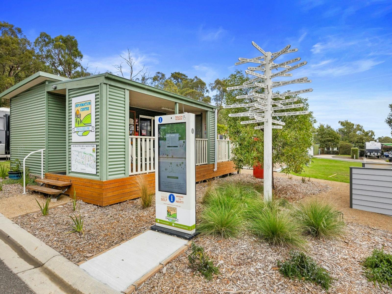 Information Centre with touch screen kiosk and pole pointing to locations in the Yarra Valley