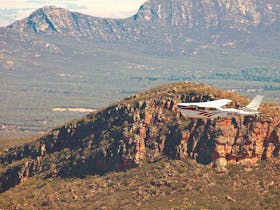 A scenic flight with Chinta Air is the recommended way to see Wilpena Pound and the Flinders Ranges.