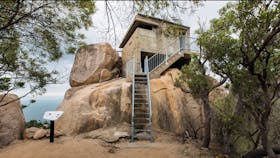 Steps up to fort on top of rocky outcrop.