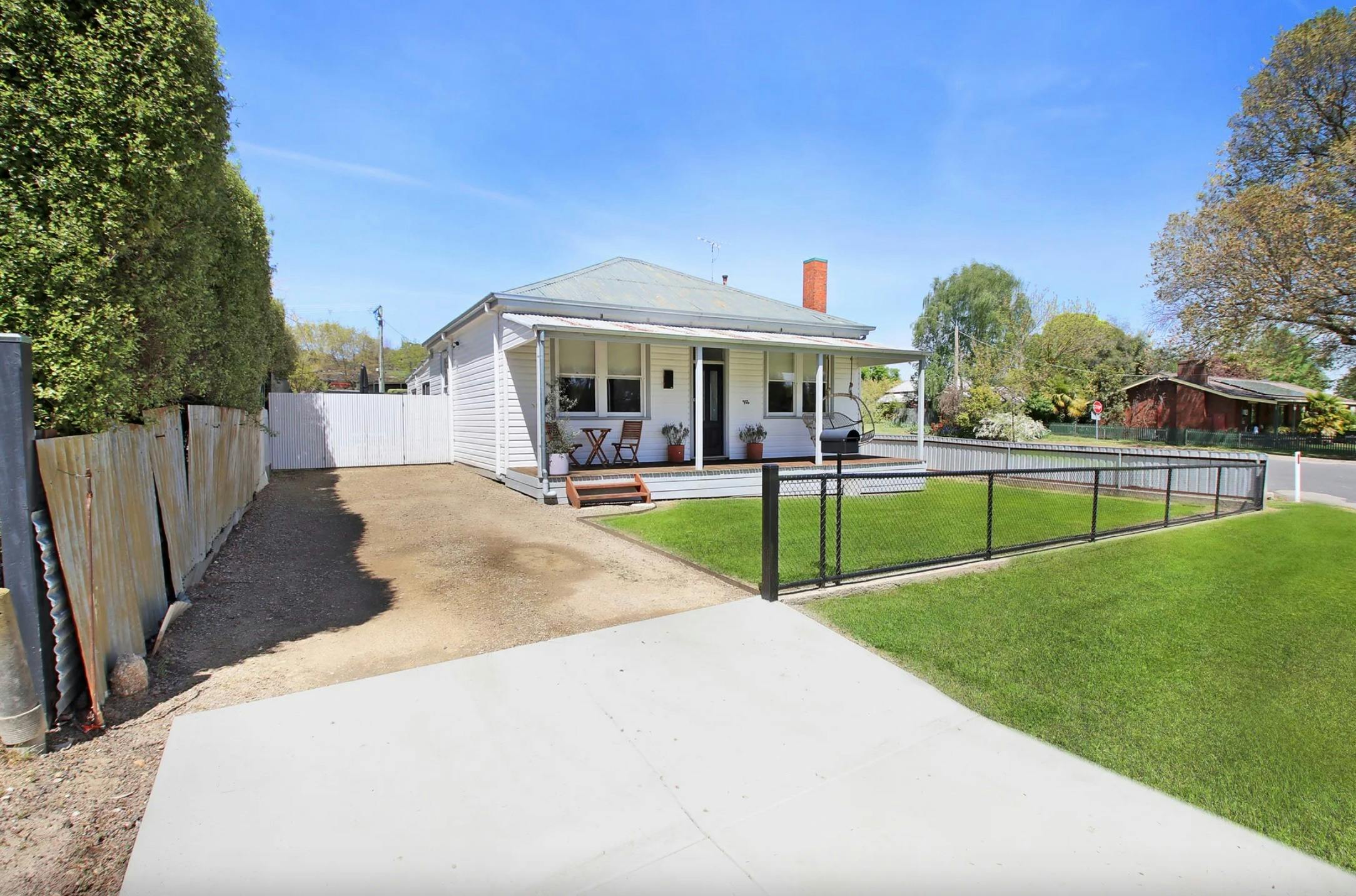 External view of the cottage with green grass