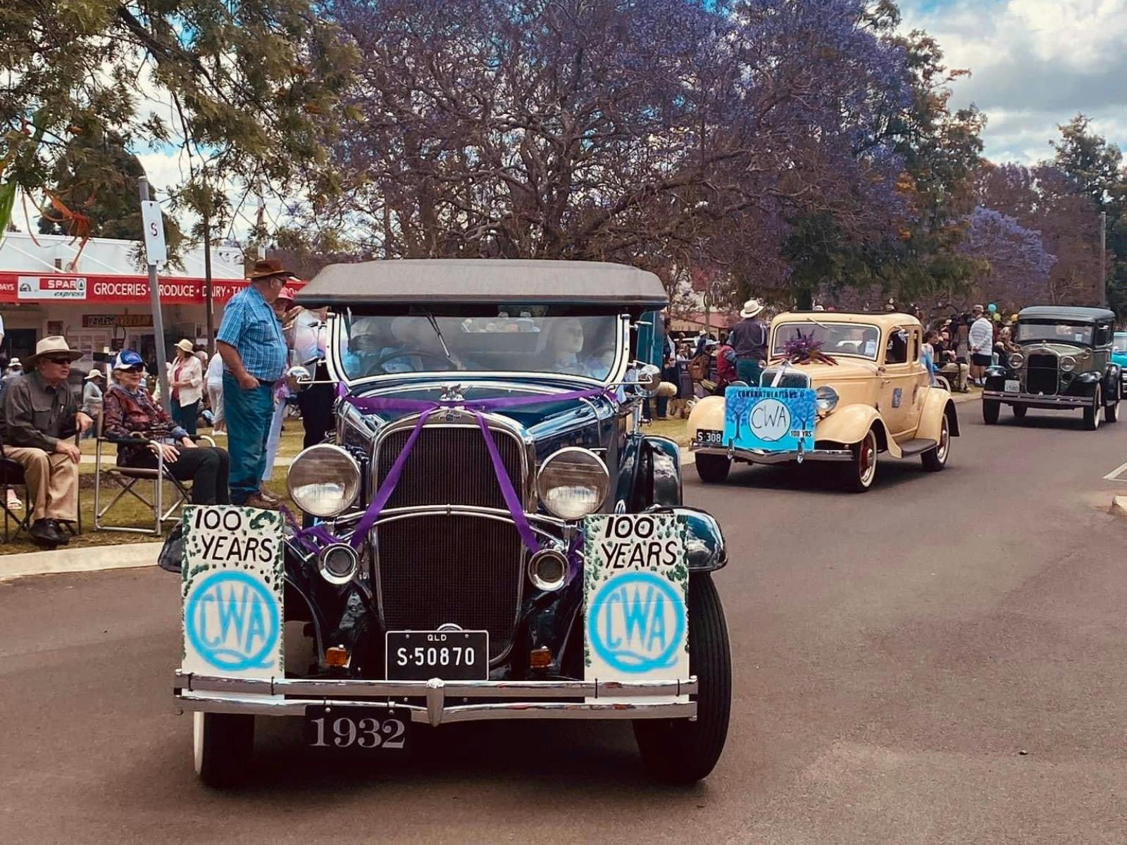 Image of vehicles in Jacaranda Day Parade Image of vehicles in Jacaranda Day Parade