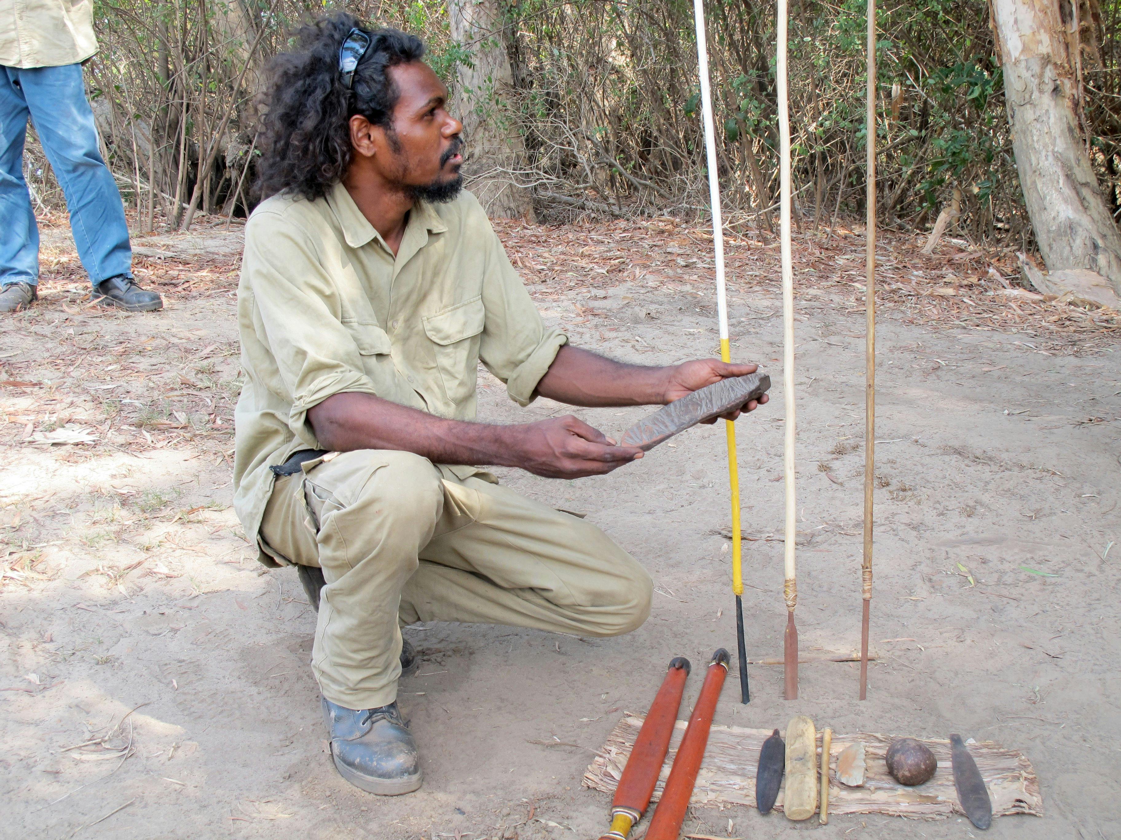 A Guluyambi Guide providing a insight into traditional utensils