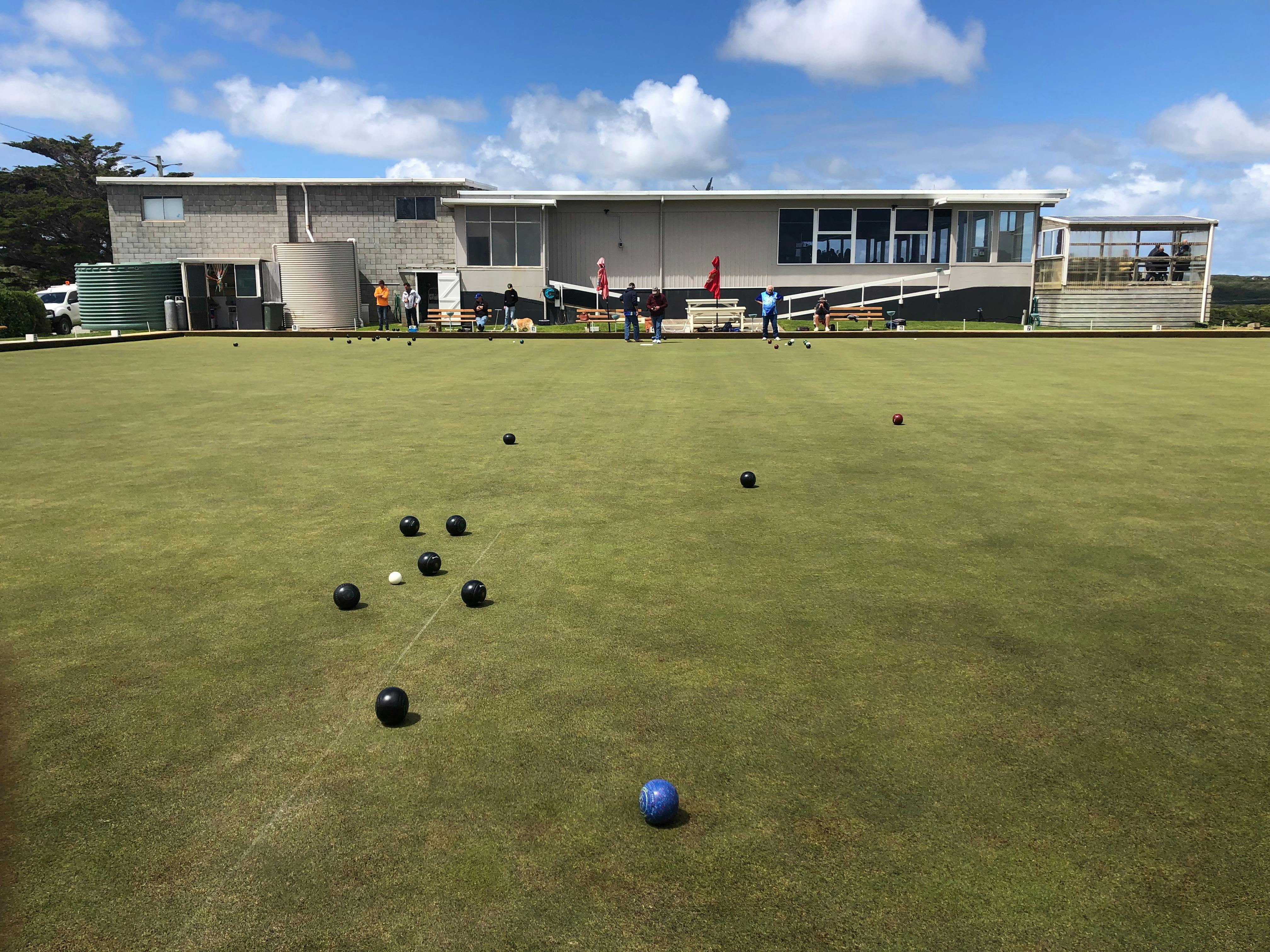 Photo of the clubhouse with the bowling green in the foreground