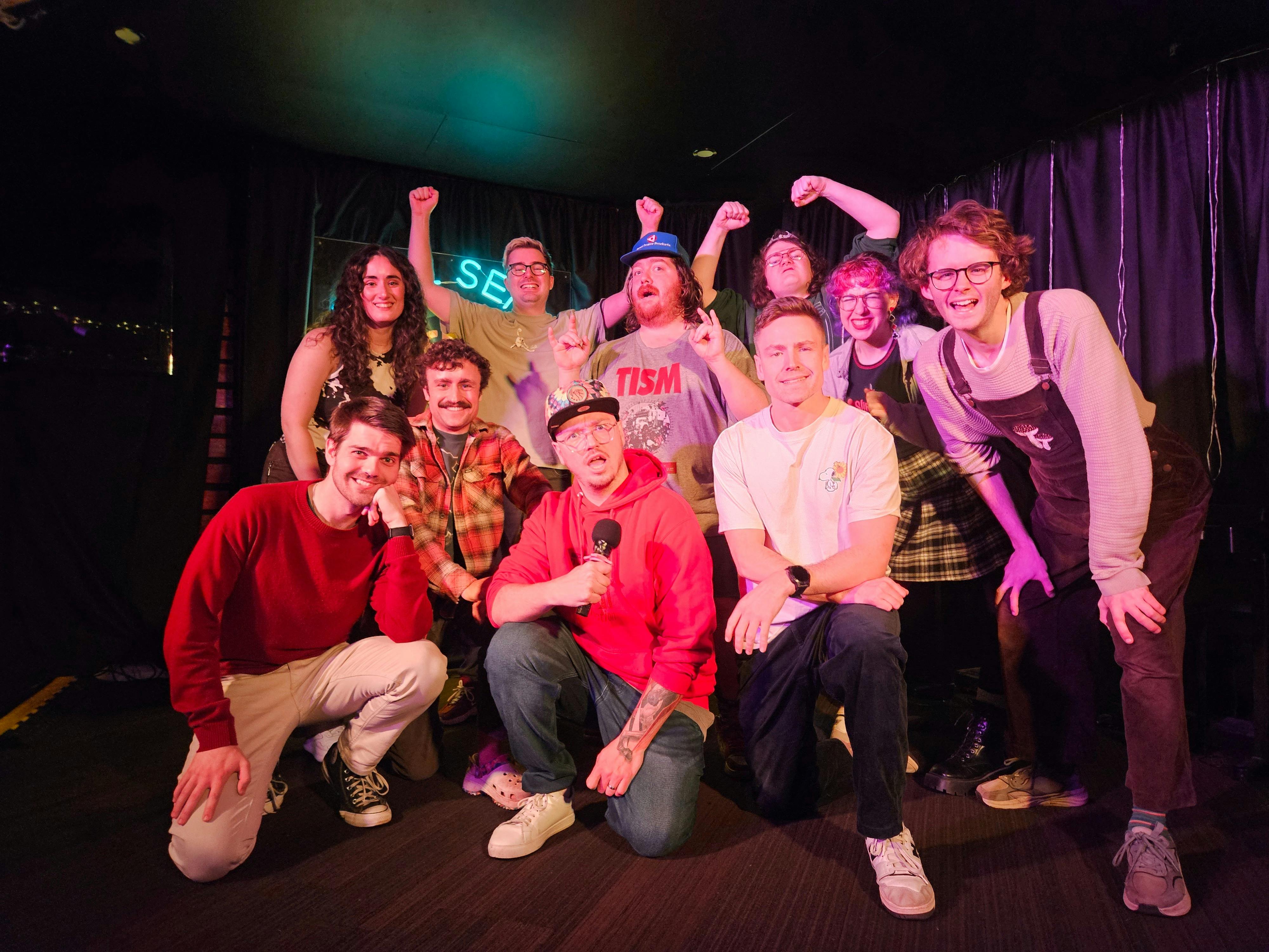 Group of people on stage celebrating